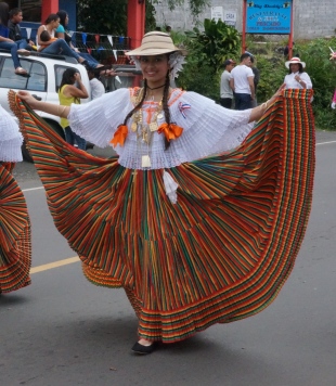 The traditional dress has full skirts and are carried like this...